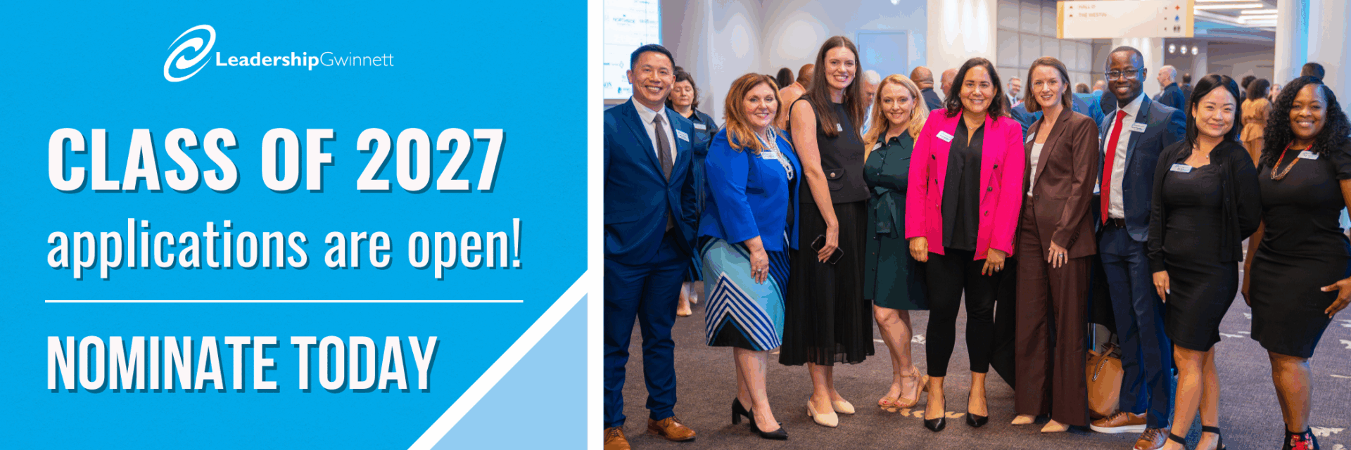 A group of Leadership Gwinnett Class of 2026 members stand side-by-side smiling at the camera at their orientation.